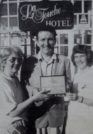 Greystones Cancer Support's Heather Finney & Peg O'Connor present La Touche Hotel proprietor Gerry Carron with an information plaque 1995 Bray People