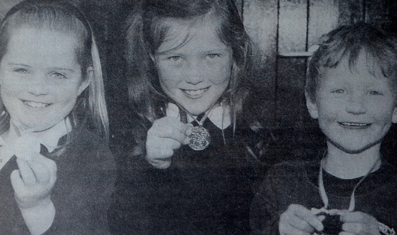 Aimee Murphy, Kate Cafferkey & Donal Duffy show off their swimming medals 1997 Bray People