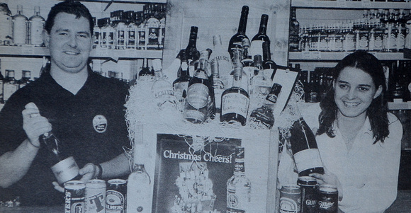 Terry Cullen & Ciara Harvey with Cheers' Christmas hamper 1997 Bray People