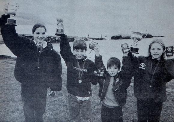 Laura, Brian, John & Emma Mitchell with their swimming trophies 1998 Bray People