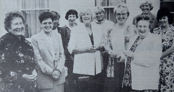 Beatrice Gunning presents Marino Clinic's Annette Hynes with a Sugarloaf Bridge Club fundraising cheque 1998 Bray People
