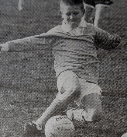 Enniskerry's Hugo Nolan shows some determination against Wicklow Town 1999 Bray People