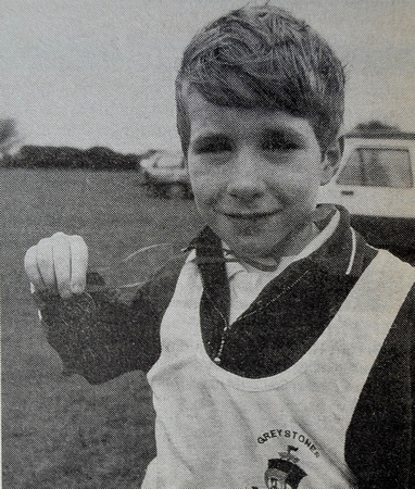 Delgany's David Fox proudly displays his Cross Country Championship medal 1999 Bray People