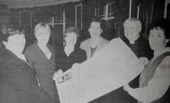 Archdeacon Edgar Swann presents Greystones Cancer Support's Lillian Longmore, Irene Gaffney, Rosemary Greenlee, Kathleen Kelleher & Theresa Kavanagh with a dirty big cheque 1999 Bray People
